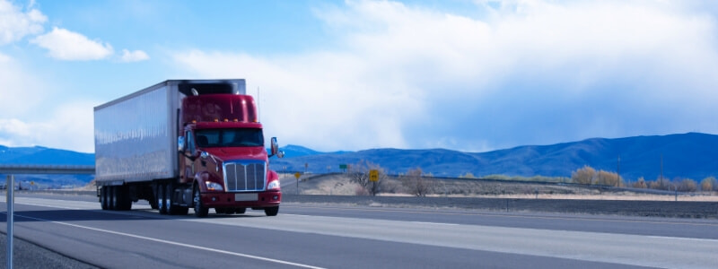 red semi-truck on the road